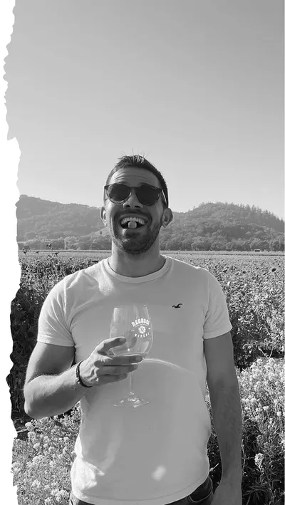 Grayscale Portrait in with wine in hand